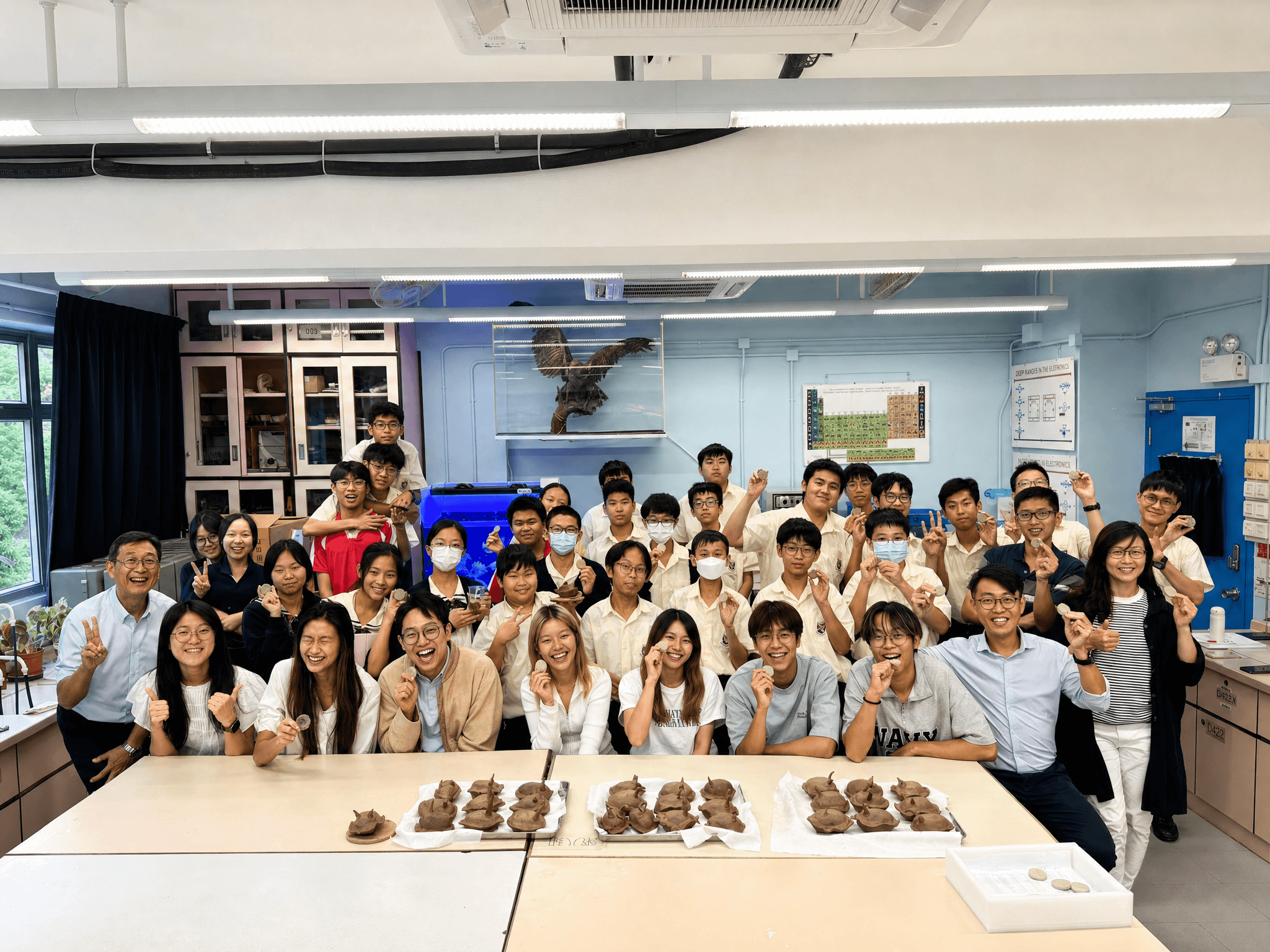 Students engaged in marine education by the coast
